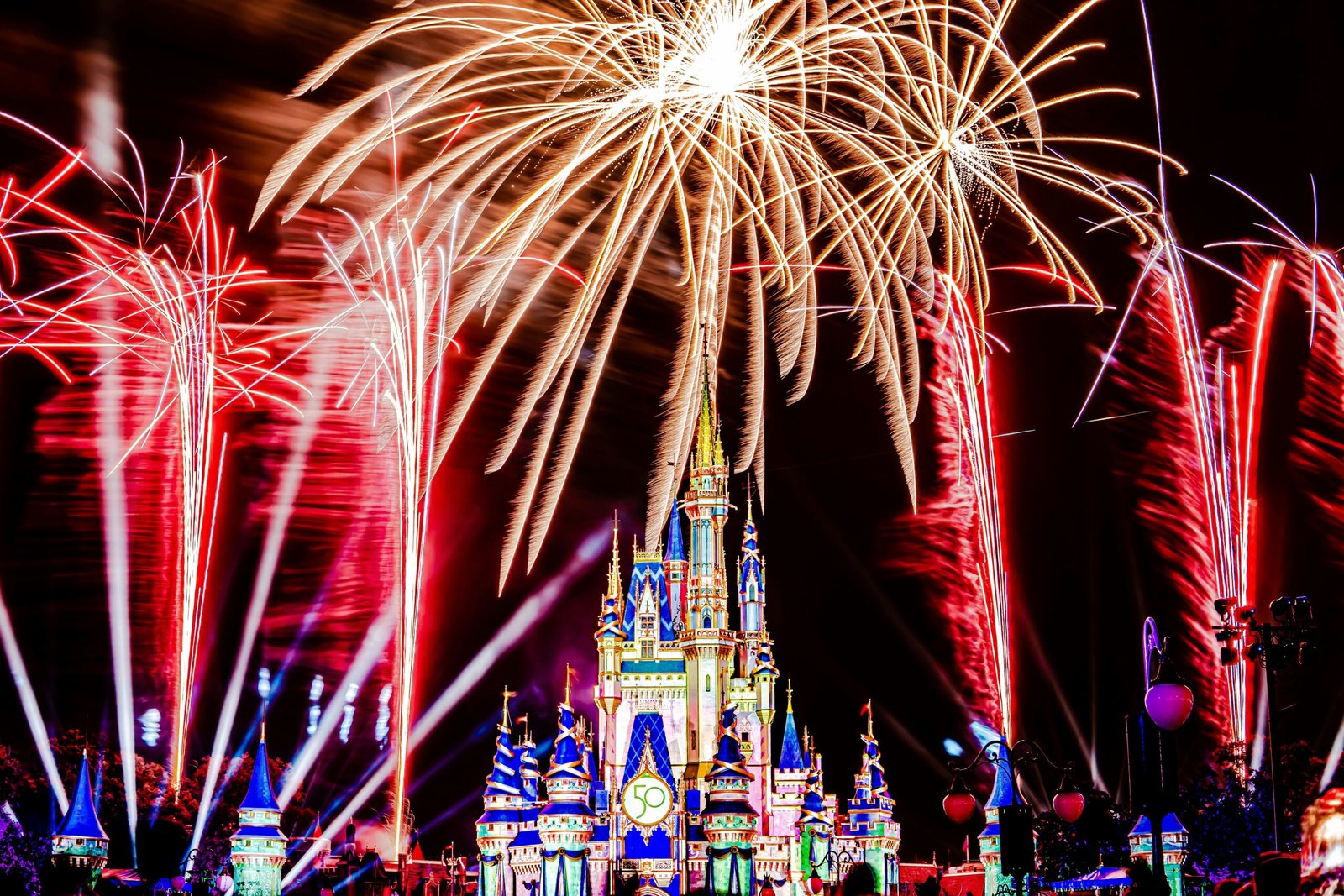 a fireworks display in front of a castle for What Does It Mean When You Dream of Having Fun